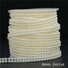 A spool of ivory pearl bead garland, measuring 2 meters per lot, used for wedding and event decoration.