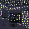 A room decorated with glow-in-the-dark star stickers on the ceiling and walls.