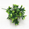 Green artificial fern and leaf sprigs used for home decor