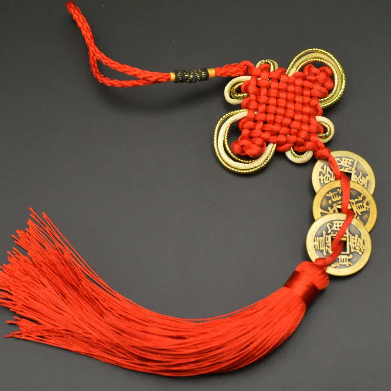 Red silk cord charm featuring a handwoven knot and copper coins for Feng Shui
