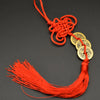 Orange thread charm featuring a handwoven knot and copper coins for I Ching Feng Shui