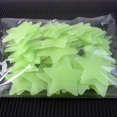 A clear plastic package containing a 50 pack of glow-in-the-dark lime green star wall stickers.