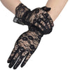 Black sheer lace gloves worn on a hand and wrist.