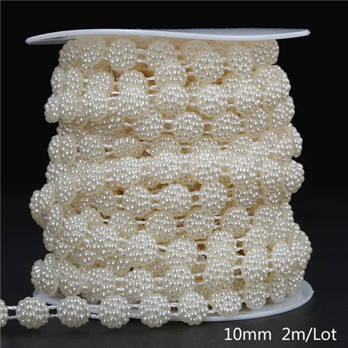 A spool of ivory pearl beads used for garland decoration, packaged with a size label.
