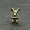A small brass statue of a mouse with large ears, designed as an incense holder.