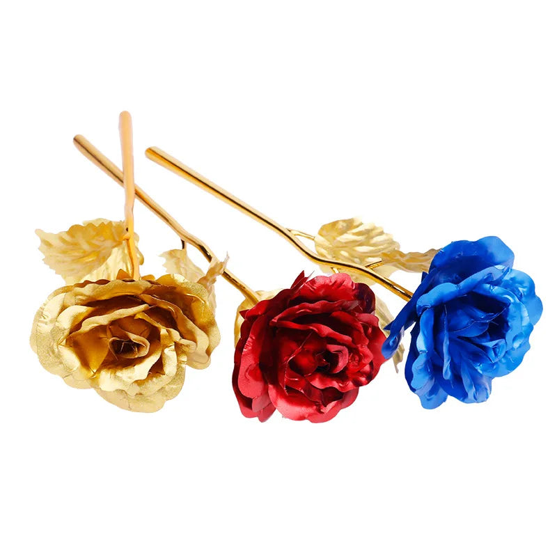 A bouquet of artificial roses in gold, red, and blue colors with thin gold wires.