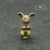 A small brass statue of a rodent animal with large ears, used as an incense holder.