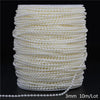 A spool of ivory pearl beads, measuring 3mm and 10 meters per lot, stacked in a cylindrical shape.