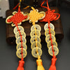 Handwoven knot charm featuring copper coins in various colors and textures for Feng Shui