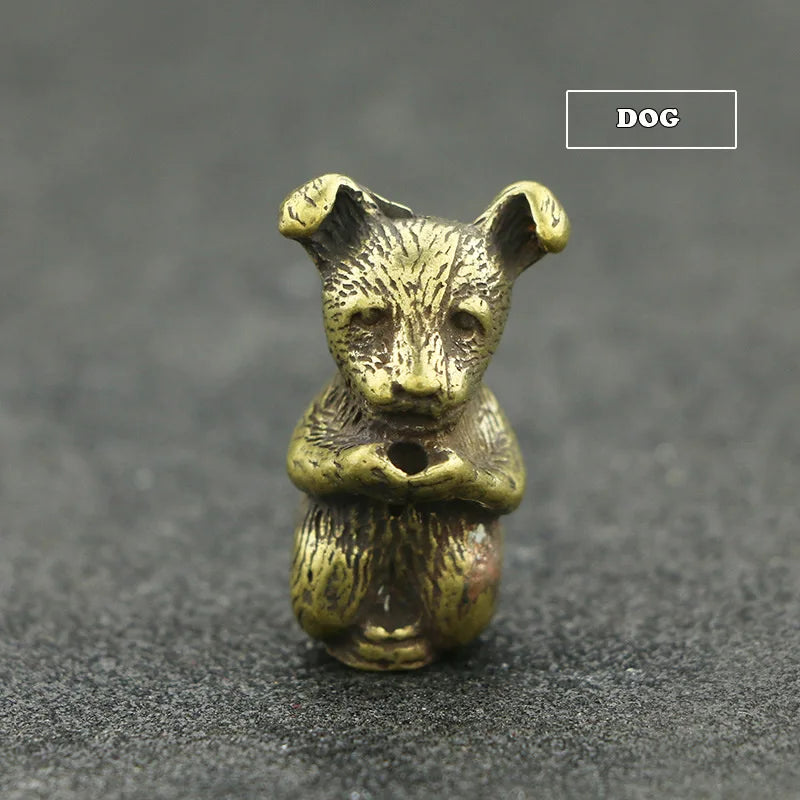 A small brass statue of a fox with upright ears, designed as an incense holder.