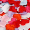Colorful heart-shaped sponge confetti in various shades of pink, red, purple, and white.