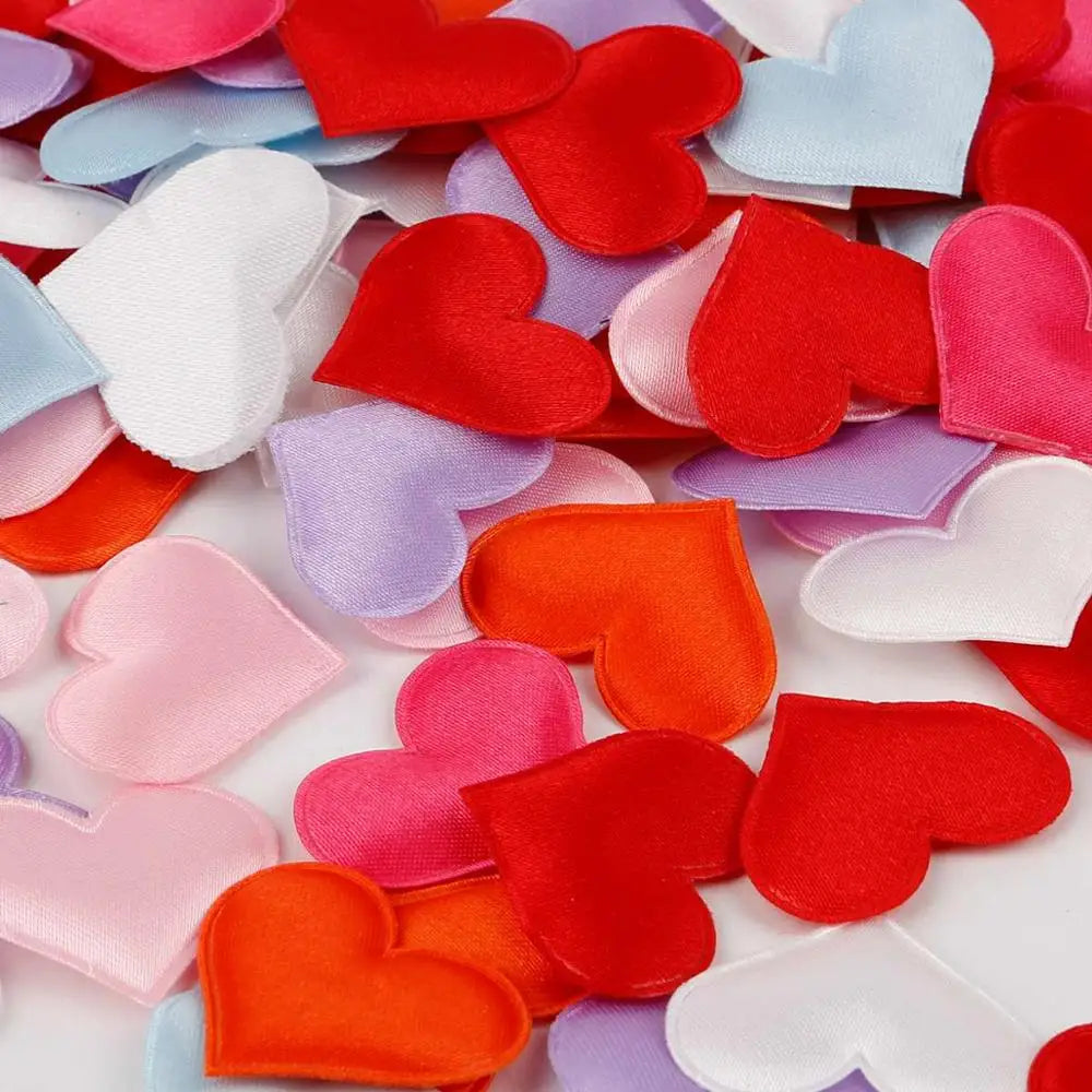 Colorful heart-shaped sponge confetti in various shades of pink, red, purple, and white.