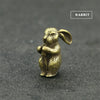 A small brass rabbit statue with ears, designed as an incense holder.