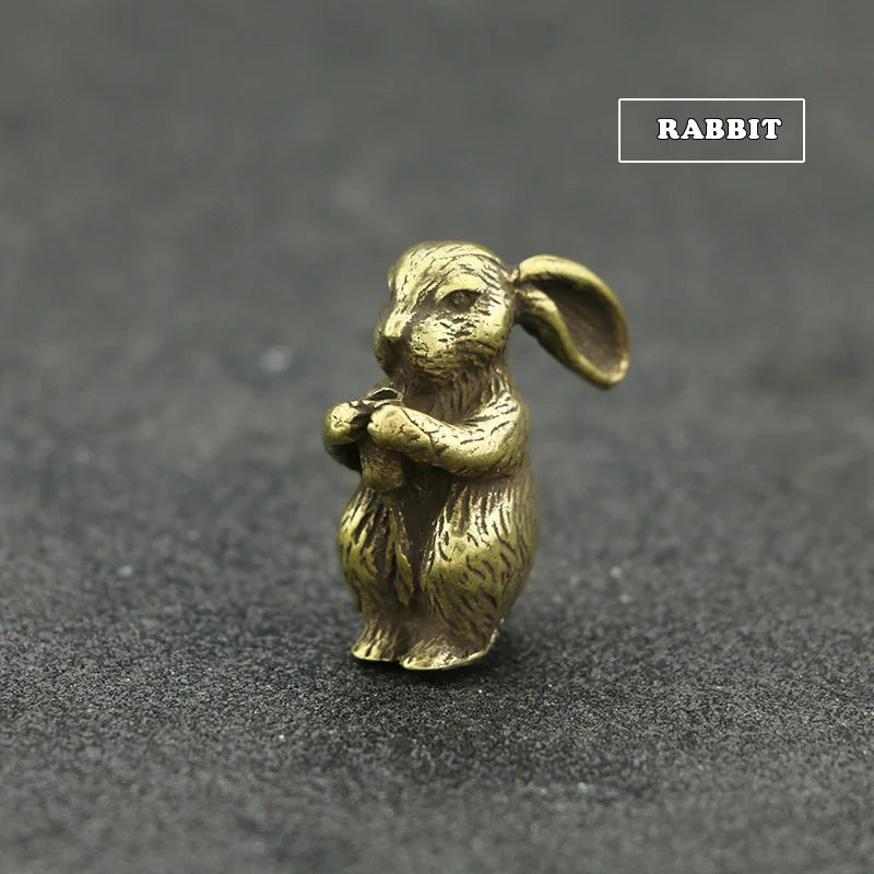 A small brass rabbit statue with ears, designed as an incense holder.