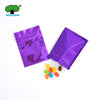 Purple foil zip bags containing colorful candies and chocolates