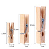 A set of natural wooden clips used for holding crafts, photos, and decor.