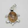 Silver pendant necklace featuring a polished, oval natural stone with brown and tan mottled patterns.