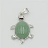 Silver pendant necklace featuring a smooth, oval, light green natural stone shaped like an animal.