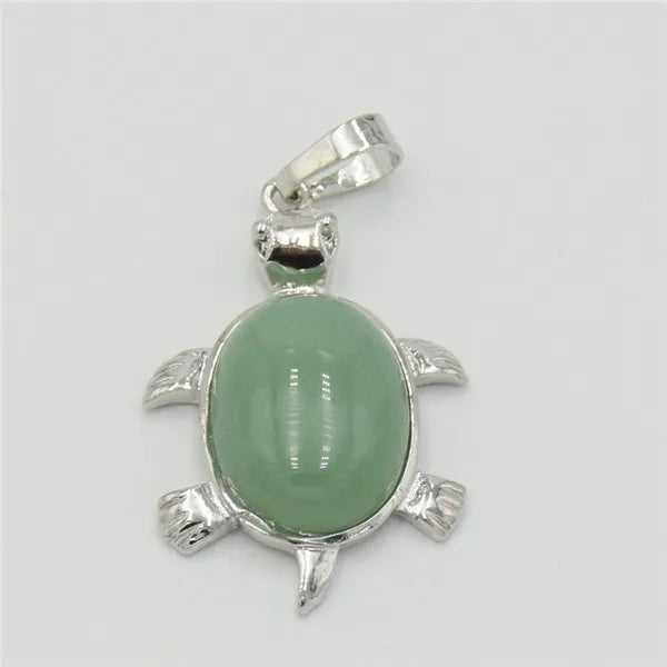 Silver pendant necklace featuring a smooth, oval, light green natural stone shaped like an animal.