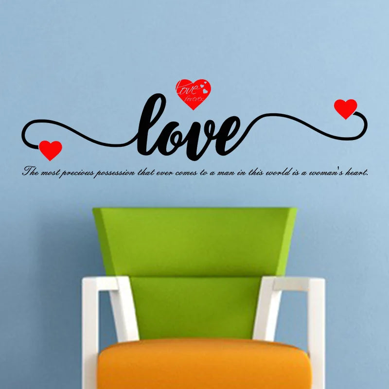 A decorative wall sticker featuring the word love in script with red hearts.