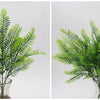 Two images of lifelike artificial fern and leaf sprigs in clear glass vases.