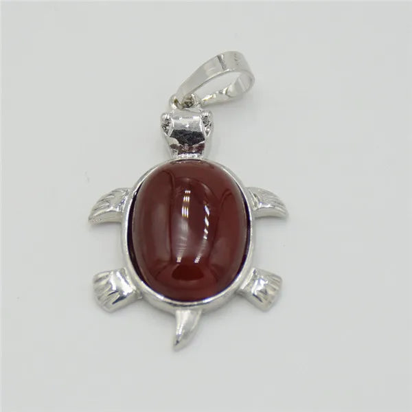 Silver pendant necklace featuring a polished reddish-brown natural stone shaped like an animal.