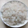 A pile of white natural unrefined sea salt crystals in a white bowl.