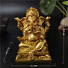Gold Ganesha statue handcrafted resin figurine sitting on a base