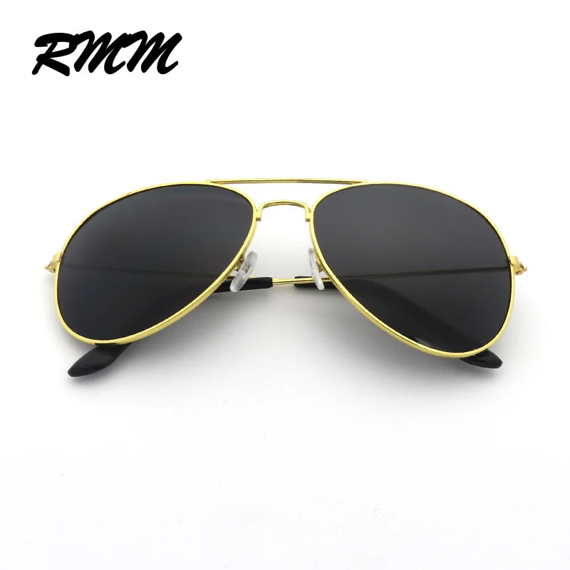 Classic gold-rimmed pilot sunglasses with black mirror lenses shown against a white background.