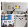 A display of various vintage warning metal signs on a wall and a sign on a white door.