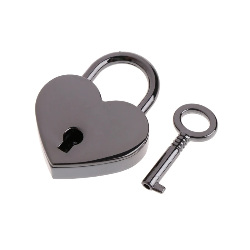 A vintage heart-shaped mini padlock and key set with a silver finish.