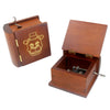 A classic wooden hand-crank music box with carved details, featuring a hinged lid and brass accents.