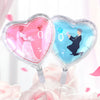 A set of ten heart-shaped foil balloons in pink and blue featuring silhouettes of a couple.