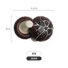A set of realistic, dark brown, textured fruit or vegetable fridge magnets with a light-colored stem.