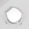 A silver mini double-sided folding makeup mirror shown from above with dimensions marked.
