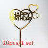 A set of ten gold acrylic love heart birthday cake toppers shaped like a heart with the words HAPPY BIRTHDAY.