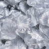 A close-up of silver silk rose petals for weddings and events, showing layered, ruffled petals.