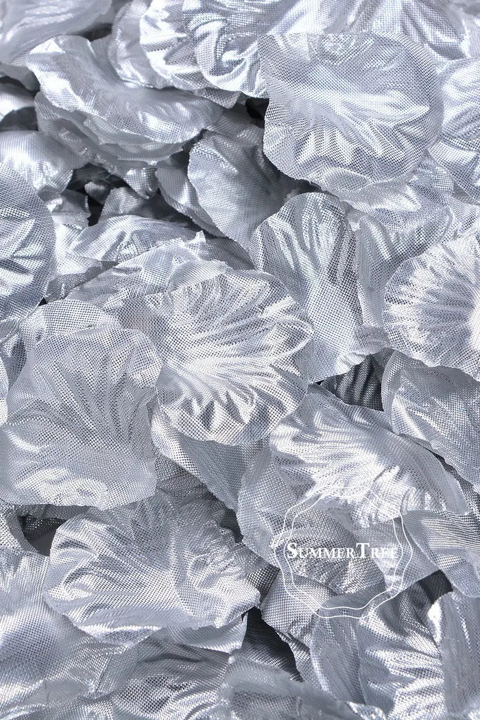 A close-up of silver silk rose petals for weddings and events, showing layered, ruffled petals.