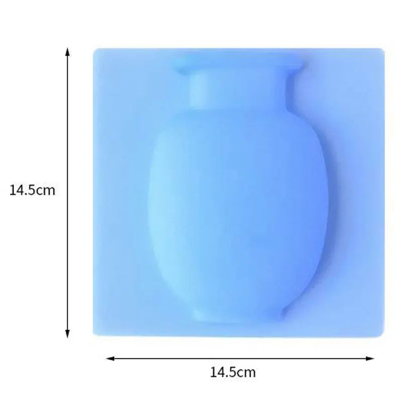 A light blue flexible self-adhesive wall flower vase with a rounded body and neck.