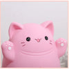 A pink cartoon cat figure designed as a piggy bank for saving money, featuring cute facial expressions and paw hands.