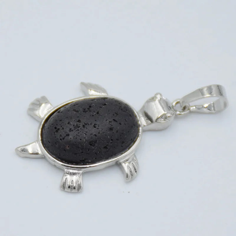 Silver pendant necklace featuring a polished black natural stone shaped like an animal.