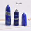 Three natural lazuli crystal point prisms displayed on a white surface.