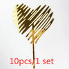 A set of ten gold acrylic heart-shaped cake toppers with a textured design.