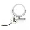 A wall-mounted LED makeup mirror with a circular frame and a silver arm for magnification.
