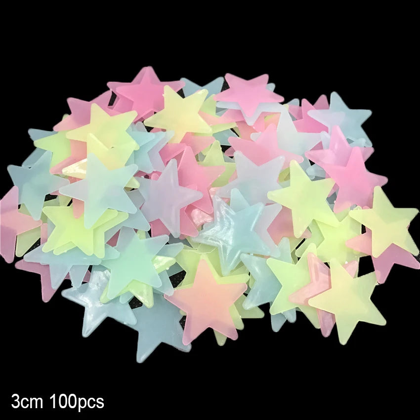 A collection of glow-in-the-dark star and moon wall stickers in various pastel colors like pink, yellow, and blue.