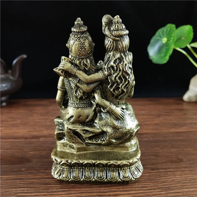 Hand-finished resin figurine of a Hindu or Buddhist deity with long hair and ornate crown.