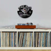 A wall clock featuring a black sports car design with a racing theme and a vinyl record display.