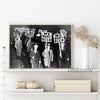 Black and white print of a vintage Prohibition-era beer sign featuring several men holding signs that read We Want Beer