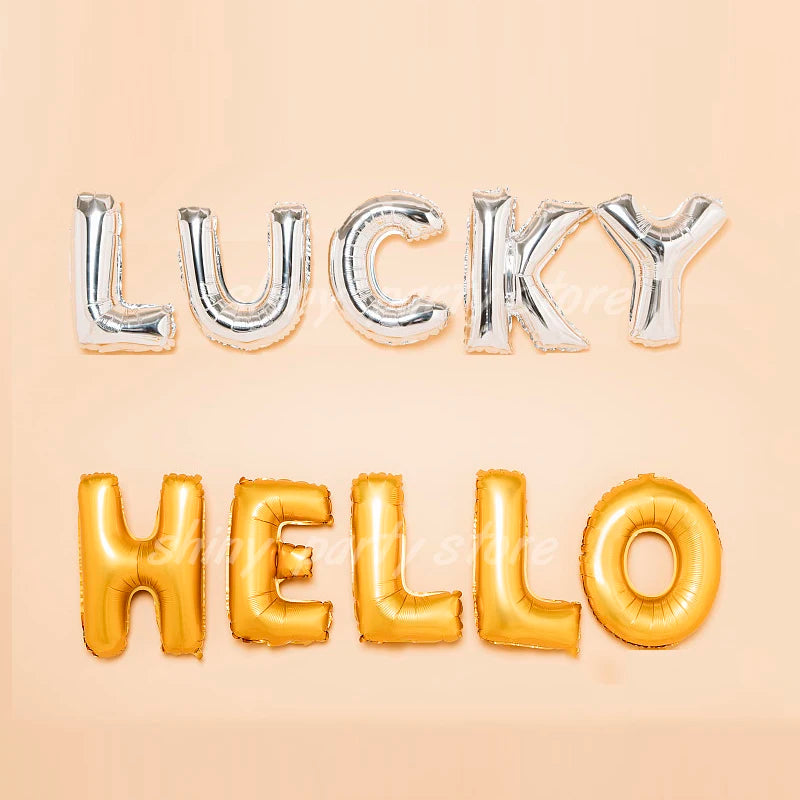 Silver and gold foil letter balloons spelling LUCKY HELLO