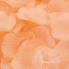 A close-up of soft peach silk rose petals used for weddings and events.